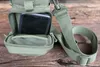 A close-up of a green tactical pouch with a smartphone inside. Produktbild-Vorschau