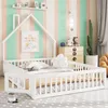 A child's bedroom with a white house-shaped bed, colorful striped wallpaper, and various decorative items. Produktbild-Vorschau
