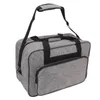 A gray sewing machine storage bag with black trim and straps is shown against a white background. Náhľad obrázku produktu