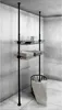 A black, adjustable, floor-to-ceiling clothing rack with two wire shelves and a laundry basket with a blanket. Náhled obrázku produktu
