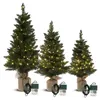 Three artificial Christmas trees of varying heights, each wrapped in burlap at the base and adorned with LED lights. Anteprima dell’immagine prodotto