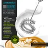 A milk frother with milk splashing around it, next to a cup of latte art. Produktbild-Vorschau