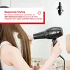 A person is using a hairdryer on their hair, with marketing text and a diagram of the swivel cord. Anteprima dell’immagine prodotto