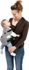 A woman is holding a baby in a baby carrier. Podgląd zdjęcia produktu