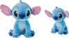 Two plush toys of the character Stitch from Lilo & Stitch, one larger than the other, are shown sitting against a white background. Produktbild-Vorschau