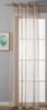 A sheer curtain hanging on a window rod.