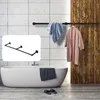 A bathroom scene with a bathtub, a towel rack with towels and a robe, and a separate inset image of the towel rack. Produktbild-Vorschau