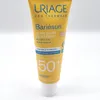 A close-up studio shot of a Uriage Bariésun tinted cream sunscreen tube against a white background. Produktbild-Vorschau