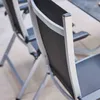 Close-up view of two outdoor chairs, focusing on the backrests and frames. Produktbild-Vorschau