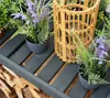 A close-up view of a wooden shelf with potted plants and a bamboo lantern. Podgląd zdjęcia produktu