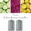 Collage of sliced vegetables and two slicer attachments. Produktbild-Vorschau