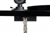 A close-up view of a black hi-fi turntable component, showing a braided cable extending downwards. Produktbild-Vorschau