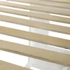 A close-up view of wooden slats on a white bed frame. Produktbild-Vorschau
