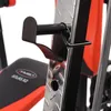 A close-up view of a black and red gym bench with a metal support structure. Produktbild-Vorschau