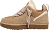 A side view of a single beige UGG sneaker with a brown sole and cream-colored lining. Produktbild-Vorschau