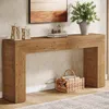 A wooden console table with decorative items and a basket of firewood. Anteprima dell’immagine prodotto