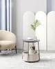 A cat resting in a pet bed integrated into a side table, next to a chair and behind a decorative screen. Náhled obrázku produktu