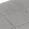 A close-up view of a quilted gray fabric, likely a blanket or similar textile product. Náhľad obrázku produktu