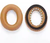 Two ear pads for headphones are shown side-by-side on a white background. The left ear pad is fully assembled, while the right ear pad is shown from the inside, revealing its internal structure. Náhled obrázku produktu