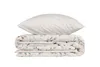 A folded duvet and a pillow are stacked on top of each other against a white background. Produktbild-Vorschau