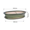 A green oval bonsai pot with a saucer, shown with dimensions indicated by lines and text. Podgląd zdjęcia produktu