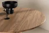 A close-up view of a wooden table with a black bowl and a glass on it. Produktbild-Vorschau