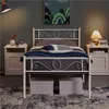 A bedroom scene featuring a white metal bed frame with bedding and nightstands. Produktbild-Vorschau