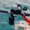 A close-up shot of a fishing rod with a reel and an attached battery pack, set against a backdrop of water. Náhled obrázku produktu