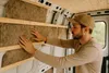 A man is installing insulation in a van. Anteprima dell’immagine prodotto