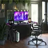 A modern gaming setup with a desk, computer, chair, and accessories. Produktbild-Vorschau