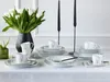 A table setting with white tulips, black candles, and a dinnerware set. Náhľad obrázku produktu