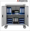An open gray metal filing cabinet with various folders and organizers inside, shown on wheels. Produktbild-Vorschau