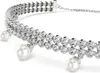 A close-up, studio shot of a silver bracelet with clear stones and pearls. Produktbild-Vorschau
