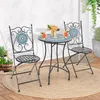 A bistro set with two chairs and a table on a patio. Produktbild-Vorschau