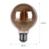 A close-up studio shot of a single filament LED light bulb with dimensions indicated. Náhľad obrázku produktu