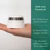 A hand holding a white smoke detector against a white background, with green overlay text listing product features. Náhled obrázku produktu