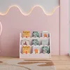 A children's bookshelf filled with books, placed against a pink wall with decorative lighting. Náhľad obrázku produktu