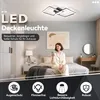 A woman is using a smartphone in a bedroom with a modern LED ceiling light. Produktbild-Vorschau