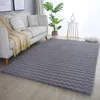 A living room scene with a sofa and a rug. Anteprima dell’immagine prodotto