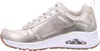 A side view of a gold sneaker on a white background. Voir les images du produit