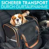 A dog is inside a pet carrier bag placed on a car seat. Produktbild-Vorschau