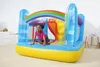 A young girl is playing inside a colorful inflatable trampoline with a rainbow design. Voir les images du produit