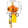 An orange electric chain hoist with a yellow chain bag and a yellow remote control is shown against a white background. Dimensions are indicated with lines and text. Produktbild-Vorschau