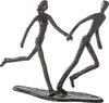 A bronze sculpture of two stick figures running and holding hands. Produktbild-Vorschau