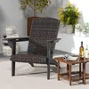 An outdoor patio scene with a chair, plants, and a small table. Produktbild-Vorschau