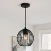 A black pendant light fixture hanging from a ceiling. Produktbild-Vorschau