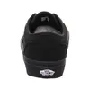 The back view of a black Vans shoe on a white background. Voir les images du produit