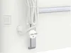 Close-up of a white electric heater with its power cord and plug attached. Anteprima dell’immagine prodotto