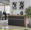 A modern dining room with a sideboard, dining table, chairs, and artwork. Produktbild-Vorschau