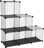 A black wire shelving unit with a stepped design, composed of six cube compartments. Produktbild-Vorschau